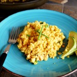 This Spicy Asian Tofu Scramble takes on the flavors of sesame and ginger, and the spice of sriracha.  Chopped scallions add a fresh crisp to this hearty and delicious scramble.